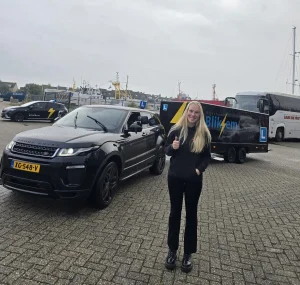 Happy Student with Rijschool Den Helder Vehicle